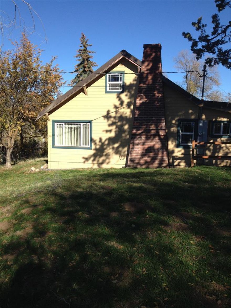 Nice, Updated Home, Just Minutes From Town. Newer Laminate And Tile Flooring With Tile Counters And Floors In The Kitchen. Spacious Living Room, Metal Roof, Front Deck As Well As Covered Back Patio. 2 Car Detached Garage For Additional Storage Or Vehicles, And A Newer Privacy Fence, Along With Fenced Front/Side Yard.