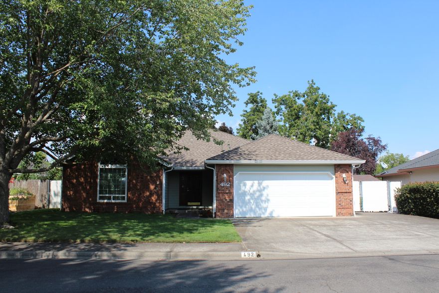 This solid sturdy home located in Jackson Creek Estates is it. Don't let the sq footage 
fool you as the floor plan lends itself to a much larger home. It features a formal entry with the large 
living room with vaulted ceilings, big picture windows and a beautiful brick gas fireplace on the left. 
Down the hall are 2 large bedrooms, a full bath and at the end is the large master offering a large walk 
in closet and in the master bath there is a walk in shower. Off the master is a slider onto the covered 
back patio in the beautifully landscaped back yard. To the right of the entry is the dining room and large 
kitchen that features an eating bar, plenty of cabinets and counter space. There is plenty of room in the 
dining area for a small family room set up and also has a door to the back patio. There is ample parking 
with gated car, boat or RV parking on the side. This home has one of the best plans and all it needs is a 
bit of updating to make it yours.