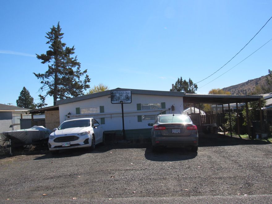 This 3 bedroom 2 bath manufactured home is currently rented and makes a great rental property. It has excellent rental income and rents for $1,010 per month. Nice sized kitchen with dining area and tile flooring. FA heat, vinyl windows, fenced back yard and it has a storage shed.
