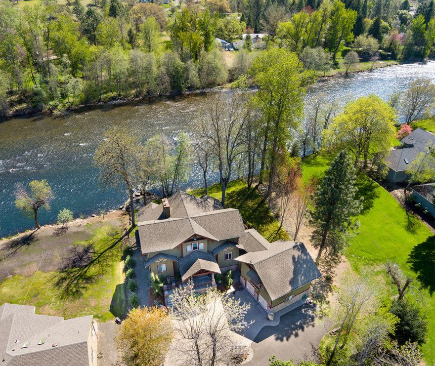 Gorgeous, custom built, craftsman style home along the Rogue River in a sought after neighborhood. This fabulous home features 4 bedrooms, 4 baths & 3716 SF of living space. Impressive great room boasts high ceilings, beautiful rock fireplace & gorgeous views of the river. Roomy kitchen features porcelain tile, custom cabinetry, high quality stainless appliance & lots of storage. Wood & stone detailing throughout provide warmth and charm. Main level owners suite with spa-like bathroom. Well-appointed guest wing with kitchen, bath & bedroom offer versatility. Upstairs are 2 bedrooms, each with their own baths, a family room, an office and more storage. 2 car attached garage on the ground floor along with basement parking for up to 8 cars & lots of storage space. The outdoors is beautifully landscaped including a small vineyard. Fenced garden, large upper deck w/river view, hot tub and easy & access to the river for fishing. You'll love sitting around the fire pit and taking in the scene