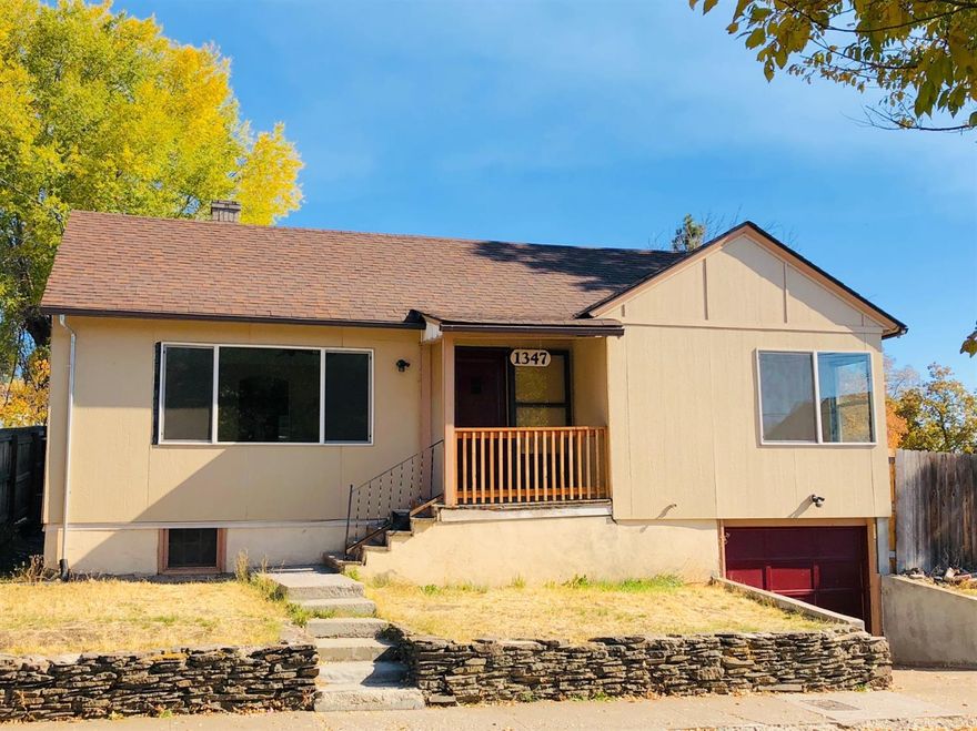 This 3 bedroom, 1 bathroom home has so much potential to make it your own. Featuring some updates throughout, along with original charm, it won't take much to make this gem shine again! Original hard wood floors, along with vinyl and carpet flooring. Vinyl and metal windows, electric forced air and air conditioning. Large living room with kitchen/dining combo and built in hutch. Large fenced back yard, with off street parking in addition to the single car garage/basement area. Schedule your showing today!