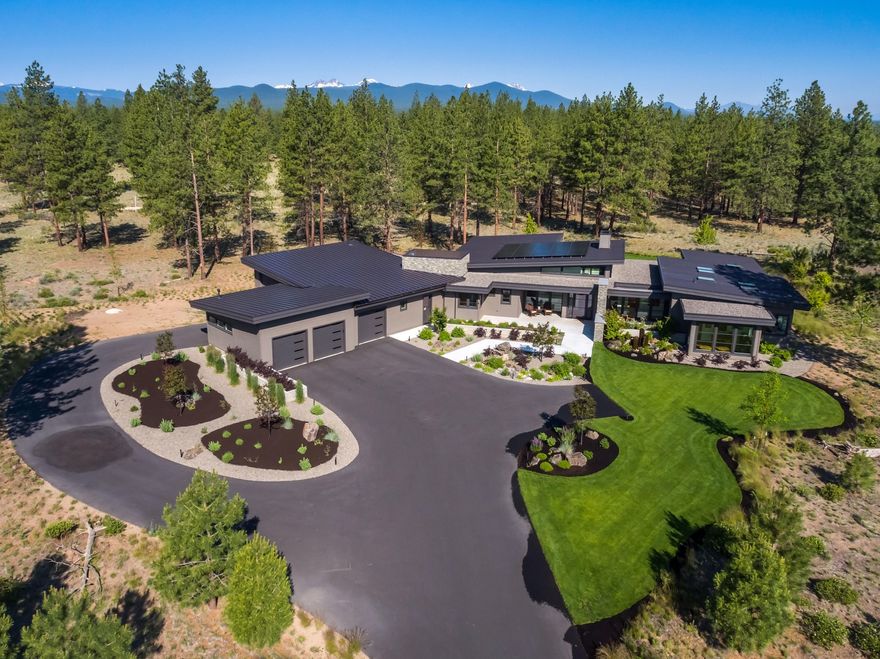 Rare opportunity to live in the exclusive Tree Farm community that offers just fifty diverse two-acre homesites on 400 acres of forest preserve. Bordered by Shevlin Park and U.S. Forest Service land, you are quite literally at the doorstep of Mother Nature's playground. Enjoy uncompromising craftsmanship and finishes throughout this luxurious single-level contemporary masterpiece: matte quartz countertops, white oak floors, custom doors and built-in cabinets; lighted bathroom mirrors; 4 car heated garage including a separate RV parking area (2,291 SF of garage space); smart home features, solar power and so much more. Soak up the abundant sunshine in your open concept great room by the custom Heterofocus 1400 polished steel, wood fireplace while fresh mountain air flows in through the oversized sliding doors that seamlessly integrate the indoor and outdoor living areas. After a long day of work or play, unwind in the private, tranquil backyard in the Hot Springs salt water hot tub.