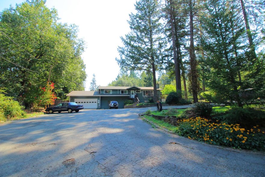 Dreaming of a 1 acre country estate, with a very roomy WORK SHOP for the mechanic and a POOL and tiki bar for those who LOVE a ''staycation'' resort lifestyle??!!
This property has everything you ever hoped for and MORE...upgraded and updated throughout! Gorgeous cozy wood burning fireplace (upstairs and downstairs) snuggle up near the fire with your book enjoying the Oregon seasons! Covered outdoor dining area allows for endless year round enjoyment of this slice of paradise! SO many options for multi generational living quarters or income (seller previously utilized as rental spaces) tastefully set up for single or multi use, just perfect! AMAZING workshop with 2 roll up doors and wood stove for project time! PLUS over sized garage.  This amazing mini estate is on a timber lined country lane, but minutes from ALL the amenities (shop/doc/dine/gym) the absolutely ideal LOCATION -location- location! Peace, tranquility and privacy await you for that next season of living your dream!