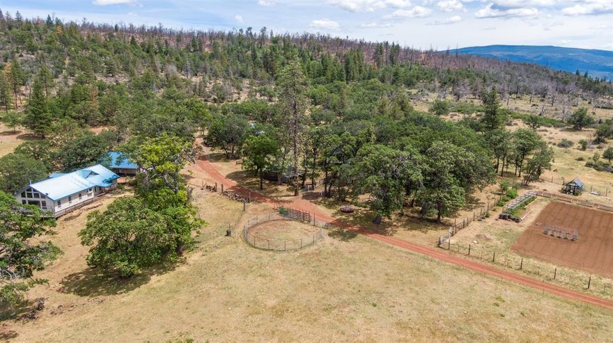 One-of-a-kind Mountain Paradise! Situated among the beautiful Cascade Mountains and the Siskiyou National Monument, Property borders over 47,000 acres of contiguous BLM/Gov't land. This 159+ acre (zoned EFU) retreat features 2 custom built homes (plus a 3rd home-site secured by a mobile), several storage buildings including 2 well equipped airplane hangers (one with additional living quarters up top), an expandable 1000' custom runway and several unique opportunities for the next owner. The diversity of the property abounds as it is naturally irrigated by a year round spring that flows to a 1+ acre catchment pond with year round outflow. Property features unmatched privacy rarely found on the market today. The multi-family setup lends itself to many uses such as a top notch turn-key hunting retreat (upland bird, Blacktail deer, elk and LOP Tag opportunity) a private irrigated farm, or simply a place to get away from it all. A complete package is available upon request!