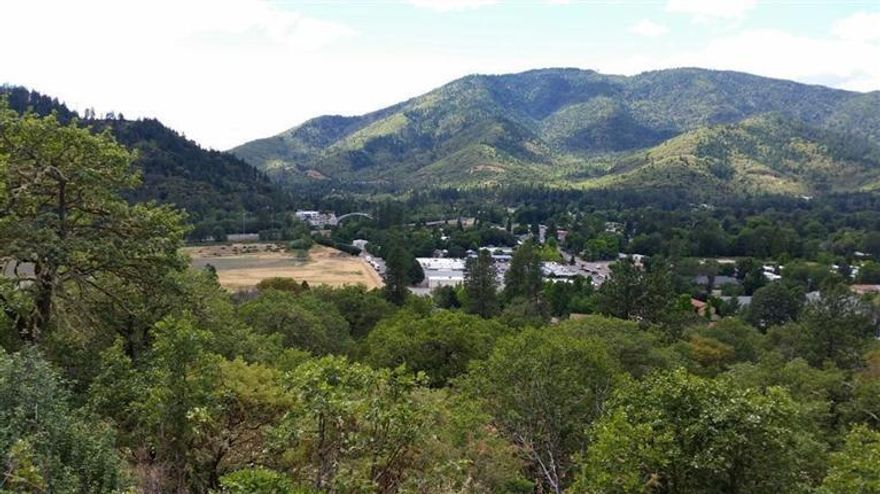 19.77 View acres less then 1/2 mile to the City of Rogue River. Zoned RR-2.5 & RR-5. Seller says Jackson County will allow up to four home sites. Located inside Rogue River Urban Growth Boundary limits and approx. 707' from the City Limits. Wildlife includes Turkey, Deer & Elk. Incredible Views of the City, Valley and the Rogue River from numerous potential Building sites. Initial road is in and power is across the property. COME TAKE A LOOK!