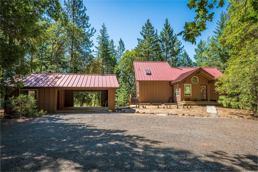 First time on the market and chalked full of local history! This 3-story open floor plan home awaits you. Nestled on top of a mountain, ten beautiful, wooded acres that makes this property your own private escape. The timber is marketable and is home to a vast array of wildlife, being backed by BLM and only 15 minutes to town. 2 Bedrooms and 3 full baths, with an open loft upstairs or potential 3rd bedroom. Completely built locally with many well thought out touches and intricacies. Down stairs hallway is a convenient pullman kitchen. Both bedrooms have sliding doors leading out to the deck making the cool crisp mountain mornings a dream. Custom built carport with two additional rooms one with half bath, creating potential for guest quarters. Plenty of room for RV parking with partial RV hook ups. Come see your completely custom, ultra-private home on 10 acres today.