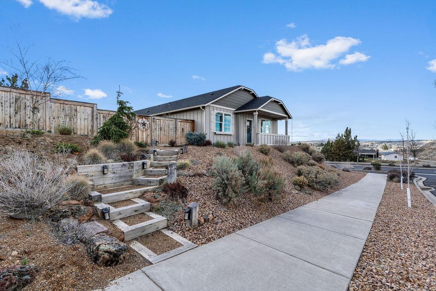 Move-in ready and better than new! This beautiful 3 bed, 2 bath single-level home, built in 2020, is nestled on a corner lot in the highly desirable Yarrow subdivision. Enjoy stunning panoramic Cascade Mountain and city views, a fully fenced yard, professional landscaping, and HOA-approved RV parking. The open, light-filled layout features a natural gas fireplace framed by windows, wide-plank laminate flooring, and a thoughtfully designed split floor plan for added privacy. The kitchen shines with quartz countertops, a full tile backsplash, island, pantry, and a versatile nook ideal for a coffee bar or home office. The spacious primary suite boasts dual closets, direct patio access, and a spa-like bath with double sinks and a full tile shower. Custom lighting throughout. Covered patio perfect for entertaining, plus a tandem 3rd car garage with flexible space for a workshop or currently housing a 16 foot boat. This is Central Oregon living at its bestâ€”schedule your showing today!