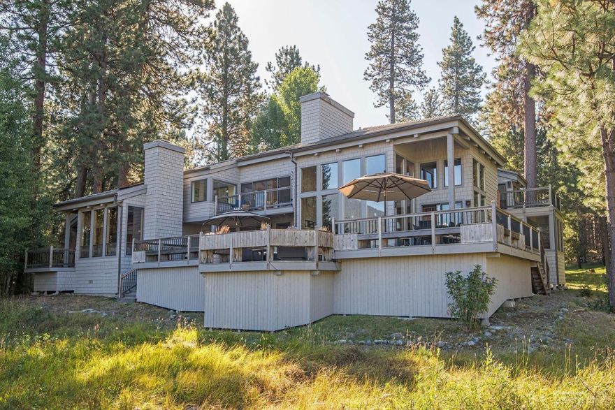 Perhaps, Black Butte Ranch's most stunning & desirable location. Located in South Meadow on a private drive, this home provides privacy and expansive views of Mt Jefferson, Black Butte, and the meadow where horses play. Wrapped in warm cedar wood, with large windows and a floor to ceiling lava rock fireplace, the great room is a place to take advantage of these spectacular views. Outside deck has planter boxes for the green thumb and is the perfect place for BBQ's with friends and family. Recently remodeled master bathrooms in both downstairs and upstairs masters bring this home up to modern finishes. Private decks off of 3 of the 5 bedrooms provide a space to relax and soak in the mountains and meadow. Wood burning fireplaces in the great room, living room and downstairs master will keep you plenty warm in the Winter. Kitchen has been updated with green granite countertops and has spectacular views through great room. This home is nothing less than spectacular.