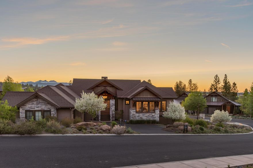 Light, bright custom Earth Advantage home set on a knoll in the Glen at Tetherow with absorbing mountain views. Here, soaring ceilings, an open great room layout, sweeping western windows, and timeless transitional finishes bring the outdoors in for maximum livability. The sunny luxury kitchen includes Thermador appliances, large butcher block island, and corner wet bar with wine refrigerator. A mostly main-level design, this home features a primary suite, two additional bedrooms, full bath, and laundry on the main floor. Enjoy sunsets from the covered wrap-around rear deck and make the most of your days with low maintenance landscaping. On the garden level, find an additional bedroom, and private living space with charming covered patio, as well as indoor basement storage for all of life's belongings.