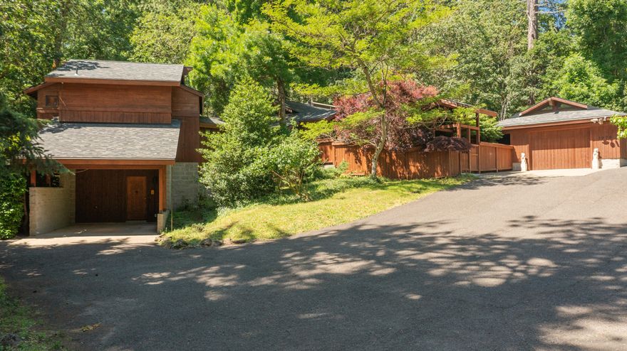 Discover a stunning Japanese-inspired retreat nestled on 1.6 wooded acres in the heart of desirable South Eugene. This extensively updated home offers over 2,500 square feet of serene living space, designed with natural beauty and timeless craftsmanship in mind. Enjoy fresh exterior staining, a new roof, new heat pump, and fresh interior paint throughout the home. Step inside to soaring vaulted ceilings, rich wood accents, and abundant natural light. The remodeled kitchen features a new island, countertops, and cooktop- perfect for everyday living or entertaining. Both bathrooms have been updated with new sinks and countertops.  A separate annex with its own garage entrance adds versatile living potential—ideal for a studio, home office, guest suite, or workshop. New flooring enhances the annex, kitchen, and bathrooms, blending style and function seamlessly.