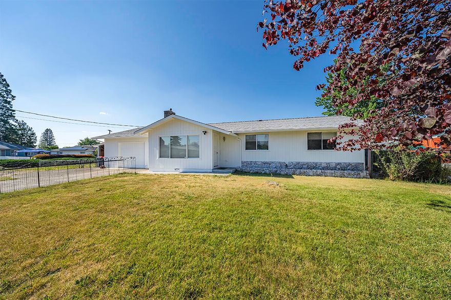 Better Than New! Fantastic, move-in ready 3 bed, 2 bath on a corner lot within minutes of schools, shopping, and freeway access. This home has been thoroughly updated including BRAND NEW laminate flooring throughout, fresh interior and exterior paint, fixtures, window coverings, and upgraded lighting. Large living room with a beautiful white brick fireplace, open to the dining area and charming French doors that lead to the covered back patio. Perfect for Entertaining! Spacious kitchen with granite countertops, black slate appliances, NEW cabinetry, and a NEW oversized stainless-steel sink. Spacious primary with a spa-like ensuite that features a brand-new vanity, toilet, tile floors and striking tiled shower with built-ins and dual heads. Mature, easy-care landscaping, fenced front and side yard, plus an office/bonus/storage area in the garage. Perfect for a first-time home buyer or investment opportunity. This home is a must tour!