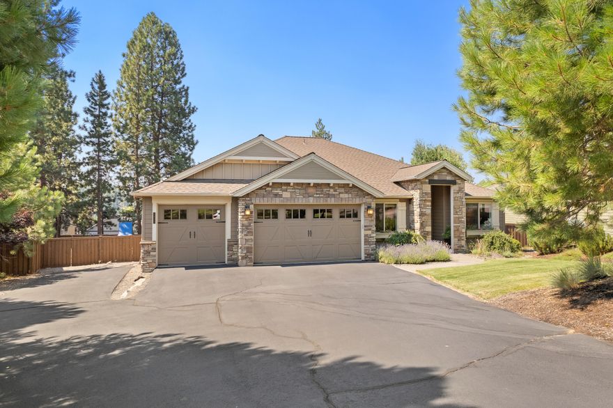 NW Style Single Level Home on .47 acre fully fenced lot w/established landscaping, raised beds & trek deck. Open floorplan offers 3 bedrooms, 3 bathrooms, 2,580 sf, dedicated office & formal/ informal dining areas. Custom features include coffered/vaulted ceilings, hardwood flooring, abundant natural light bringing the outside in. The Primary suite offers a new carpet, access to deck, quartz vanity with under counter sinks, soaking tub, privacy glass, tiled walk- in shower & spacious walk-in closet with built in's. The great room offers a stone fireplace with built in cabinetry, chef's gourmet kitchen w/ large island & features floor to ceiling windows. Guests will enjoy the 2 spacious guest suites with full baths. The ease & flow of indoor/outdoor entertainment offers nice options with three sliding doors for gathering your family and friends. Additional amenities include RV parking, a 3-car garage with built-in cabinets and workspace, laundry room with cabinets & sink. Welcome home!