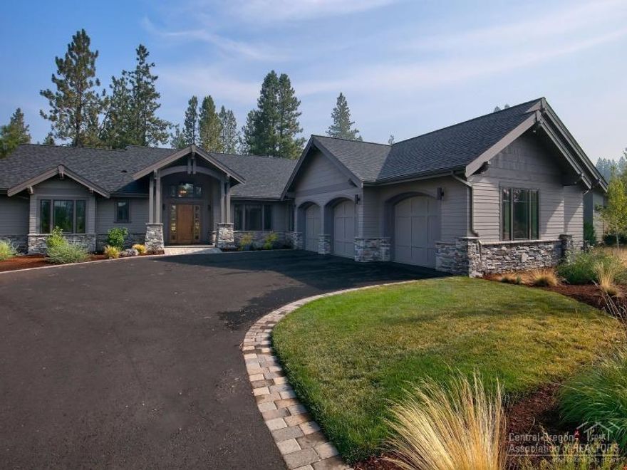 Exceptional single level in Tetherow, backing to the 7th green at Broken Top. Beautiful setting in the trees, w/ views of both the 6th & 7th fairways. NW contemporary lodge design w/spacious rooms, lots of light & wood floors. Vaulted great room, covered patio, chef's kitchen, den w/box beam ceiling. Good separation of bedrooms. Luxurious master w/private patio. Large utility room; 3-car garage over 1000 sf. Great neighborhood with many amenities, adjacent to the forest, close to schools & downtown Bend.