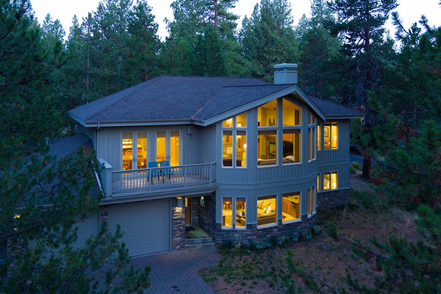 Immaculate 5 bed / 5 bath home just steps from the river!  Enjoy sunsets through oversized windows while sitting next to the fire.  Mingle in the spacious kitchen while cooking your favorite gourmet meals amongst friends and family.  Downstairs you will find the hot tub, a family room with a bar, and three large bedrooms!  This home has three primary bedrooms, each with their own bathroom.   If you have been waiting for a 5 bedroom with class, comfort and quality...this is it!