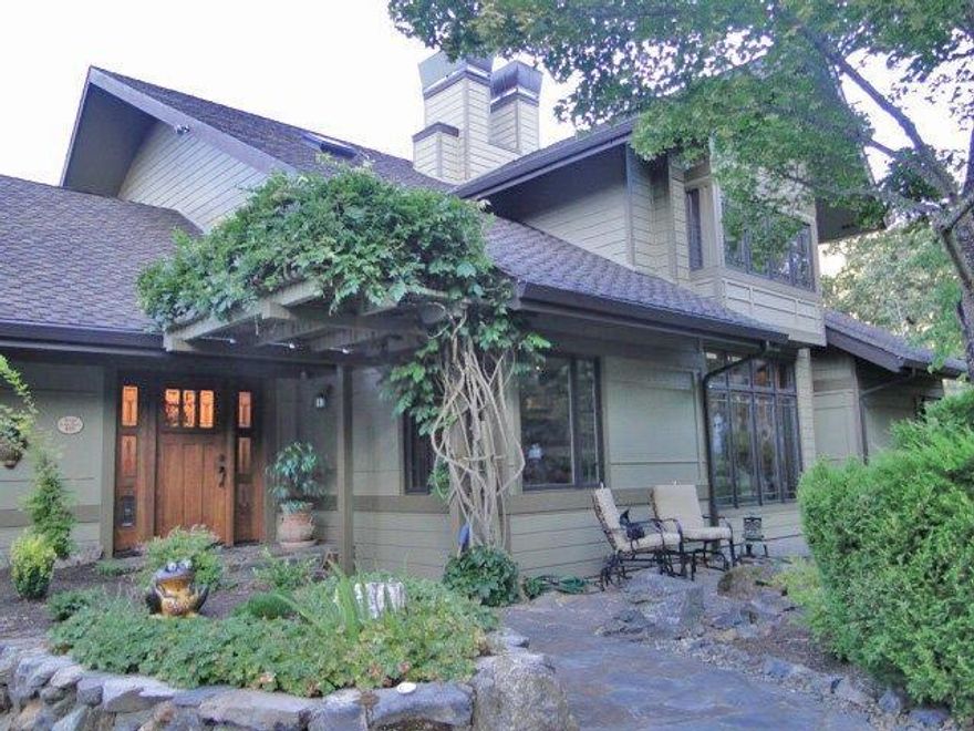 Exquisite home in secluded neighborhood, built by local, premier builder, John Magallon. Home design is inspired by a Frank Lloyd Wright plan which was voted best plan of the year by Better Homes and Garden. Three bedrooms, 3.5 bathrooms, bright and open home with lots of gorgeous windows allowing nature to spill in. Cherry wood flooring and custom built-ins. Auspiciously situated at the confluence of a seasonal and year-round creek. Asian influences in construction and garden design. Detached guest studio, large carport with workshop, and garden shed/art studio to take advantage of painterly light. Large kitchen garden steps away from wrap around balau wood decking. Rock from property stacked and terraced connecting buildings and garden. Privacy and serenity for the most discriminate of buyers.