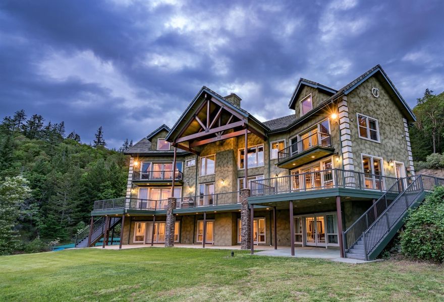 Welcome to one of Southern Oregon's finest rural estates! This property features 77 acres of its own private valley, miles of groomed trails, a stunning main home, half mile paved driveway, garage with workshop, second dwelling, & breathtaking views. With 5 (+/-) miles of established trails for off-road vehicles, horseback riding or hiking this is a true recreational oasis! As a bonus, the property backs to vast limited-access BLM acreage (1700 (+/-) acres) that wraps around the northern & eastern boundaries & assures privacy. The property overlooks the Applegate Valley with scenic vistas that are breathtaking. The gated entrance to the property gives way to beautiful open pastures & a year-round pond. The center piece of this estate is a magnificent 6794 SQFT elegant estate home. The home is stunning & provides an elegant lodge appeal! The property is located at the beginning of the Applegate Valley Wine Trail, & 7 miles from Grants Pass. See Virtual Media for Complete Details.