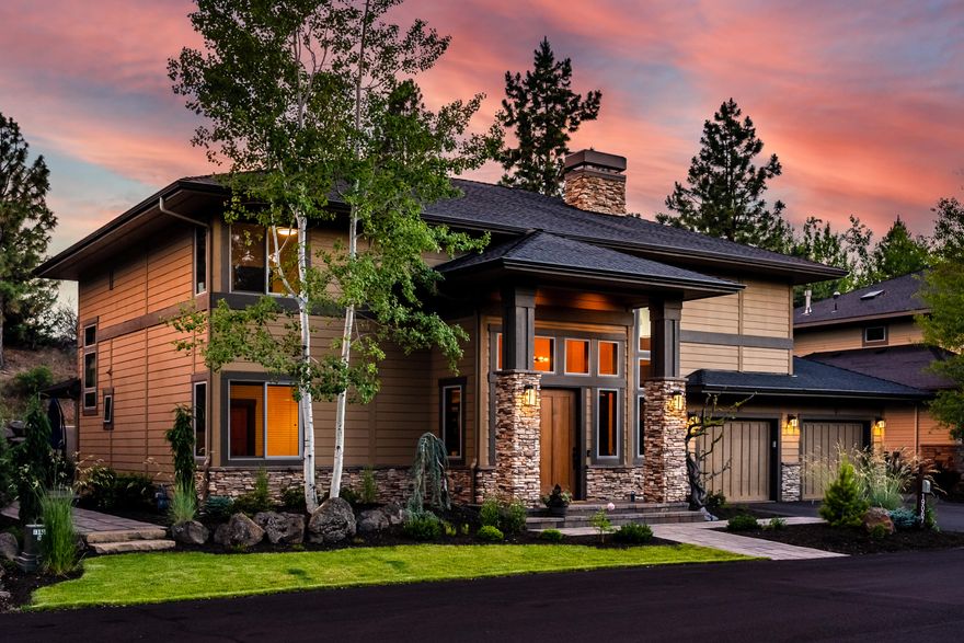 Stunning contemporary home near Shevlin Park in Three Pines! The truly grand great room welcomes you w/ soaring ceilings, fireplace, & open concept layout. Enjoy the newly remodeled chef's kitchen complete w/ large island, Wolf range, quartz counters, wet bar w/ beverage fridge, custom cabinetry, & wine cellar. Just off the spacious dining room enjoy thoughtful built-ins w/ dual desk spaces that work great as home offices. Main floor also includes a guest bedroom/flex space, full bath, large laundry room, pantry, & attached 3-car tandem garage. Upstairs you'll appreciate the elegant design of the balcony looking down to the 1st level, a junior suite w/ full bath, & a huge
primary suite w/ its own fireplace, full tile shower, jetted tub, & spacious walk-in closet. Covered patio is perfect for entertaining w/ outdoor tv, & custom designed seating area complete w/ fire table, as well as a private space for your hot tub. This is the ideal NW Bend home you've been waiting for!