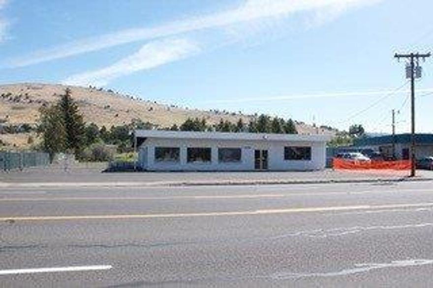 Price Reduced! $169,000. Owners motivated, will consider owner carry. This prime location is perfect for a retail,rental or warehouse business. Plenty of parking, fenced yard, and roll up door for easy access. 6000 sf. Building located in busy commercial location. Easy visibility and access. beautiful tongue and groove ceiling. General Commercial zoning. Building has some deferred maintenance and sold in as is condition. Buyers to do their own due diligence.