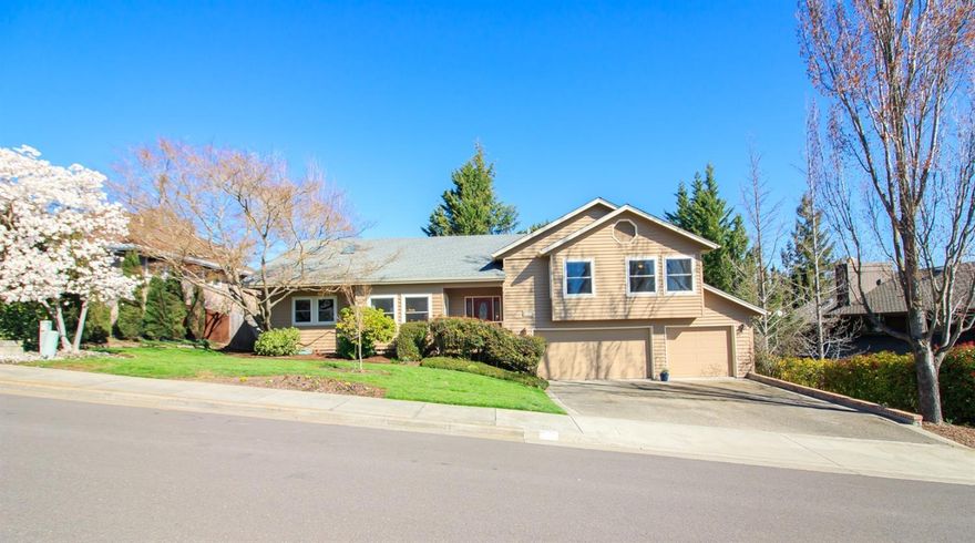 Well maintained and move-in ready. This beautiful home has w/in the last 10 years had many updates including new gas heat pump, vinyl windows, water heater, kitchen counters, new bathrooms and recently refinished hardwood floors. Lots of windows and skylights throughout make this a light, inviting home. Large living room w/ gas fireplace and vaulted ceiling & skylight and nearby formal dining area. Kitchen w/ wonderful granite counters, island w/ eating bar, area for informal dining. Bonus room w/ vaulted ceiling offers options for multiple uses - relaxing, recreation, office/den. Master suite w/ large walk-in closet, soaking tub, granite counters, skylight. Guest bedrooms have fan/lights. Guest Bath w/ heated tile floor, tub/shower & skylight. The 4th bedroom, 3rd bath and utility room are downstairs. Large 3-car garage. There are multiple decks for enjoying the gorgeous fenced back yard with lots of trees and plants. Perfect for entertaining or relaxing.