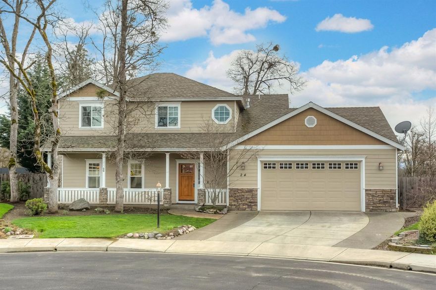 Lovely traditional two story home nestled on a quiet cul-de-sac. This home is situated on a spacious lot & backs to open area with beautiful views. Beautiful hardwood flooring & upgraded trim work throughout, plus a well thought out floor plan. Open great room w/kitchen open to family room with fireplace. Crisp, white kitchen offers versatility w/eat in bar and built in desk; also stainless steel appliances & granite counters. Formal dining room w/ French doors open to additional living room. Upstairs master suite is spacious w/vaulted ceiling & fan. Master bath w/large jetted tub, double vanity, shower & walk in closet. Enjoy lovely views from the master suite balcony. 3 additional bedrooms upstairs. Mature landscaping and garden beds. Oversized 2 car garage w/a huge shop area for your projects too. Special Financing Incentives available on this property from SIRVA Mortgage.