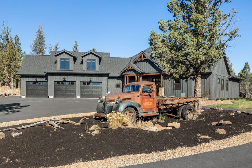 Welcome to your Sisters dream home. Stunning Northwest Contemporary home built by Tee Harbor Construction. Sited at the end of a quiet lane on a spacious 2.58 acre lot backing to forested BLM land . Upon entering the home you will notice the attention to detail in every direction from the real Ponderosa wood board and bat siding to the timber framed accents and the floor to ceiling masonry wood burning fireplace. The open kitchen is a chef's dream with Thermador appliances, complete with quartz countertops, a large kitchen island perfect for entertaining and plenty of custom cabinetry to store all of your cooking utensils. The master bedroom is a retreat in itself with the walk in tile shower complete with rain soaker shower head and porcelain soaking tub with a view of the forest. The back porch is essentially a covered outdoor living oasis with a peaceful water feature. oversized 3 car attached garage and detached 2,064 ft shop with 2 large bays a 50' RV garage with full hookups