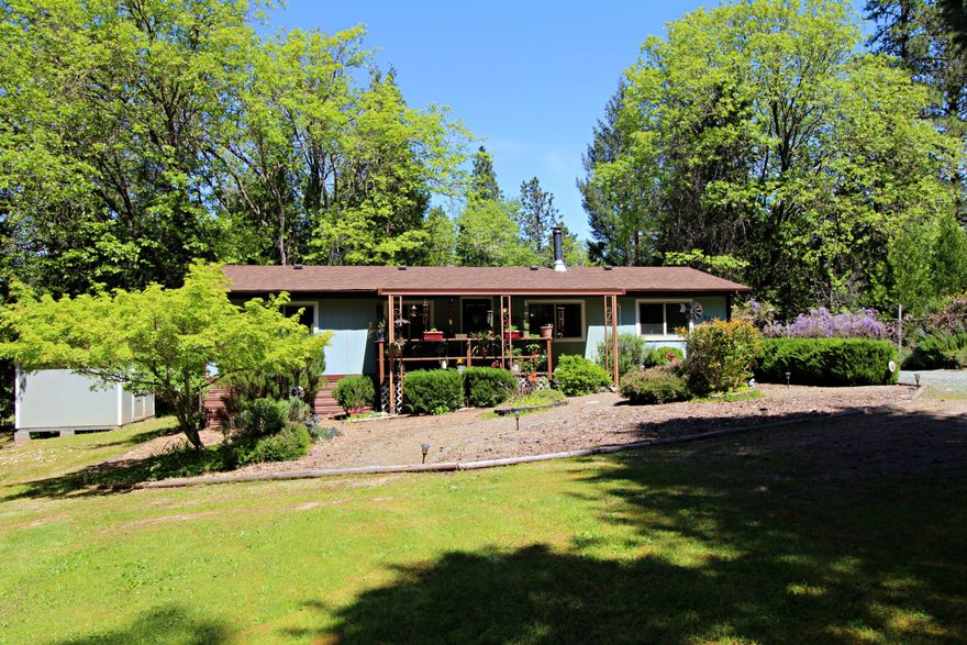 Here is a well maintained 3 bedroom 2 bath home on a versatile, semi-private 2.5 acres. 
The property offers fabulous trees, with open areas that would allow you to have a garden and animals, large or small, there is room for RV parking, there is a greenhouse, additional storage sheds and is fully fenced. The home is in great condition, inside and out, the roof was replaced in 2019, both bathrooms and the heating/cooling system has been updated, front and back porches add additional enjoyment space. The property is tucked back from the county road with a very rural feeling, but still close to town and with low county taxes.  This is not a drive-by, you cannot see anything from the road, schedule your showing before this one is gone.