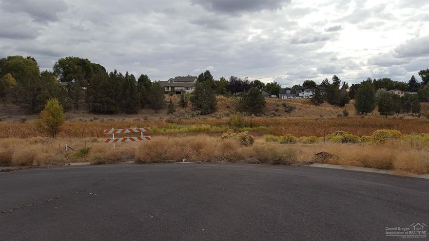 Residential lot in quiet Northeast Prineville. Area of newer homes. Back to nearly two acres of open space.