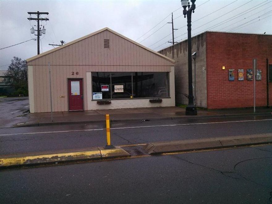 One of a kind commercial property in downtown Central Point. Over 3,000 sq ft of open space and storage room. 30K +cars per day. High exposure on Main Street through town. Seller willing to owner carry or entertain an all cash offer. City says Zoning is EC, retail, office, services