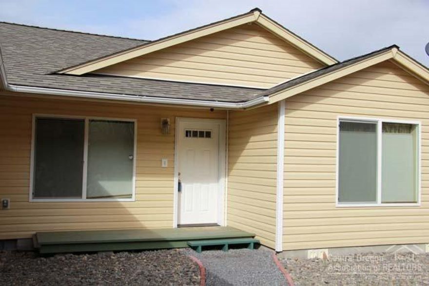 Newer home with acreage and amazing Cascade mountain views. This 3 bed 2 bath home offers a spacious great room area, attached double car garage as well as shop and 2 storage buildings.