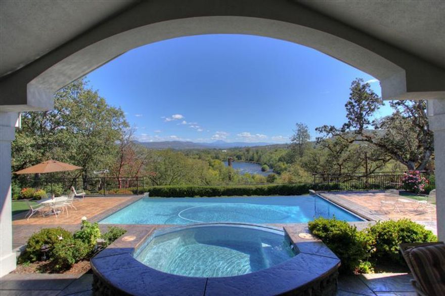 Exquisite contemporary custom home on 34 acres on the Rogue River. This gorgeous year around riverfront home property features 3 bedrooms, 5 baths, and 5291 sq. ft. of luxury single level living. Brazilian cherry floors, geothermal heating & air, 2 fireplaces, central vac, security system, granite counters throughout and top-of-the-line stainless steel appliances. Infinity pool & spa with expansive views of Mt. McLoughlin and the Rogue River grace the grounds of this amazing property. Master suite has walk-thru tiled shower & huge walk-thru closet. Enjoy the formal dining, living, office, game & workout rooms. There is also a large laundry room with sink & separate bath, 3 1/2 car attached garage plus separate 2400 sq. ft. enclosed RV/shop. There are even facilities for your animals.