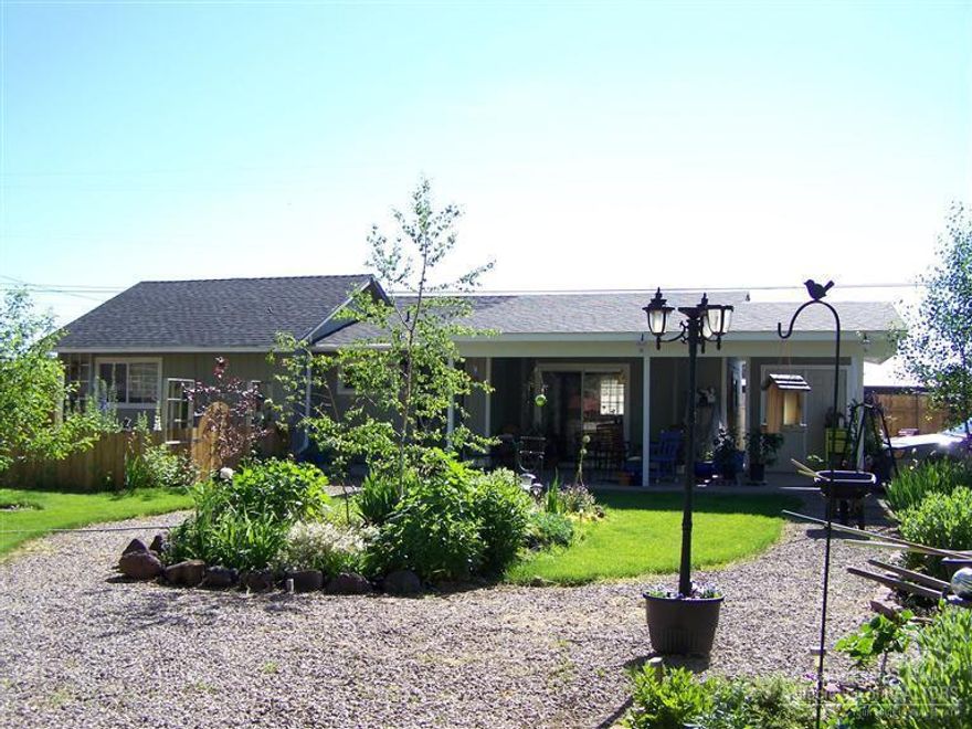 Turn key property. Two tax lots totally fenced. Newly remodeled home. New ductless Heat pump,AC, pergo flooring, tile, new cabinets, etc. Landscaped yard...flowers, fruit trees, green house, dog kennel or chicken coop. A must see property !!!