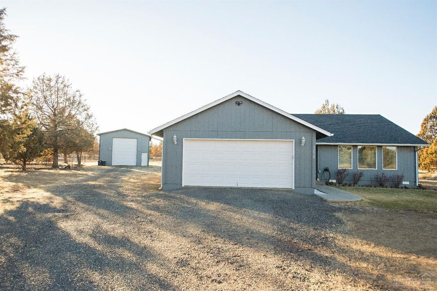 Free BUYERs Home Warranty! This inviting home is nestled on a serene private 5.25 acres. Come enjoy the breathtaking sunrises and sunset of CRR from this 1704 sq ft light and bright home with lots of upgrades! Turnkey property features large living room with pellet stove, dining area and large kitchen with updated stainless appliances. New laminate wood flooring and fresh interior and exterior paint! Huge master suite and both bathrooms updated! Don't miss the large 864 Sq ft shop with 14' door!