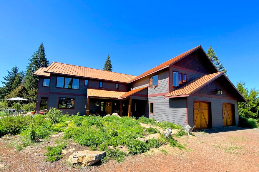 Spectacular Highland Meadow Ranch offers amazing beauty & privacy. Situated on 160 acres of fenced, EFU land, 60 acres of which is also cross fenced, with water rights from Grizzly Creek & bordering acres of BLM lands. There are two dwellings, ½ mile apart, 2 wells, a spring-fed pond, marketable timber, & breathtaking views of Mt. McLaughlin. The main home has skyline windows with views from every corner, radiant heat, granite counters & the warmth of gorgeous cedar, fir, & cherry woods throughout. It is 3 bedroom/3 bath, plus a sunroom. The solar-powered log cabin is 1 bedroom, 1.5 baths, with a separate well, & has been registered as a vacation rental, rented for $180/night. There is also covered RV parking, with hook-ups. And 2 covered shelters for your horses or livestock. Newer solar panels & self-contained batteries for the off-grid system. A barn, dog kennel & pickleball court. There are four gates that open to miles of trails on BLM land. Don't miss this remarkable offering