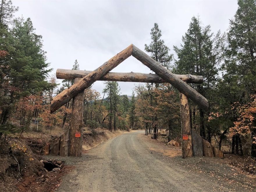 639AC+/- Reclusive Ranch Enclave at Historic Landmark Flounce Rock. Pristine end of private road privacy beyond massive log arched gateway and bordered by USA & large acreage private parcels! 75+ acres water right. Ranch features distinctive large barn with completely remodeled 1 Bdrm, 1 Bath Tack Room Bunk House, New Laundry room, Plus Stainless fish cleaning station! Equipment outbuilding. Like new Powder River cattle working station with feeder included! New Post & Rail fencing borders the structures and some penning areas. Original 1925 built 2 Bdrm, 1Bath home is unlivable, but is a dwelling allowance for your new rural ranch lodge! Total of five parcels provides potential for additional multiple dwelling allowances. Elk & Deer in the area and close to Lost Creek Lake and Rogue River fishing and recreation. Could make a great horse property, alternative crops, or premier recreation rural ranch estate.