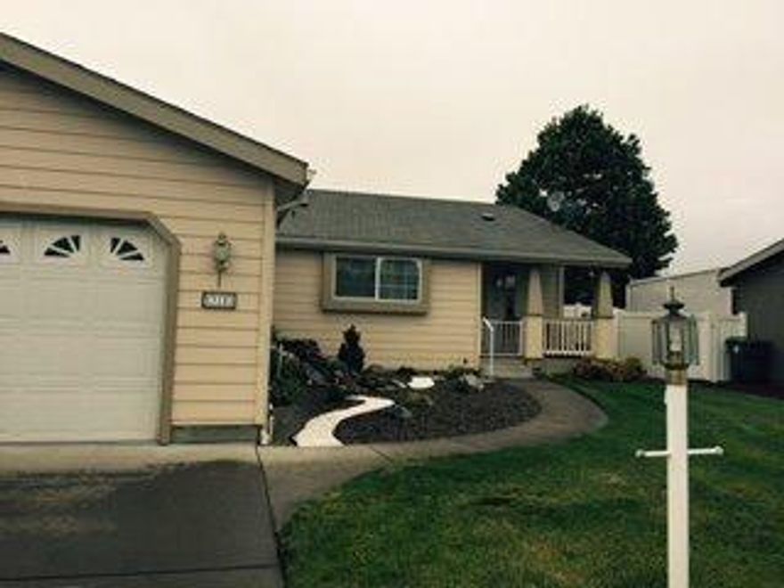 3 bedroom, 2 bath home in Miller Estates 55+ living. Triple wide 1872 sf with open floor plan. Large kitchen with center island and breakfast bar. Great room with vaulted ceilings, gas fireplace. Master bedroom with large walk-in closet, private bath and ceiling fan. Separate laundry room with oversized storage space. Two car garage. Large covered patio. This is the largest lot in Miller Estates. Vinyl fencing along property provides easy access to side grass landscaping and new raised beds for gardening. Possible RV parking.