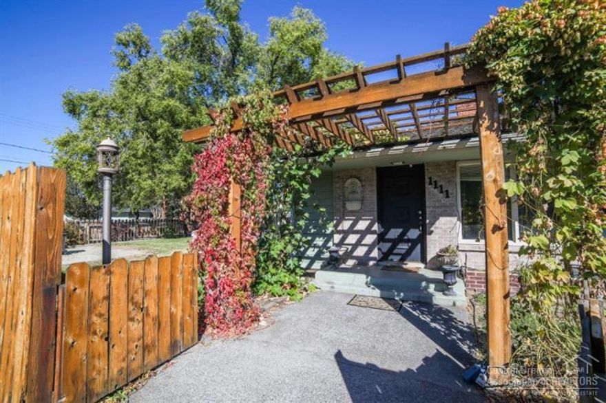 One of a kind home in SW Redmond. Built in the 50's w/charming details. Expansive living room w/fireplace & huge windows. Master Suite w/contemporary style bathroom, dbl sinks, walk thru closet. Spacious bedrooms & tons of storage! 3rd bedroom has another brick wood burning fireplace & adjoining craft/hobby room. Enclosed breezeway/mud room w/cold storage pantry & attached double garage & covered storage area. Gas forced air heat & A/C on a .2 acre corner lot, fully fenced & ready to go!