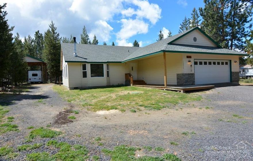 Custom built single level home on one acre. 3 bedrooms, 2 bathrooms, 1800 sq ft home with open floor plan, vaulted ceilings, wood burning stove, bamboo floors in entry, living room and dining area. Kitchen has maple cabinets, newer stainless cooktop, microwave and refrigerator. Large Master and fresh interior paint. Seller will give $2500 carpet allowance. Plenty of rooom to store your toys. Attached garage 24x24, extra shop 24x24, covered RV parking 30x20.