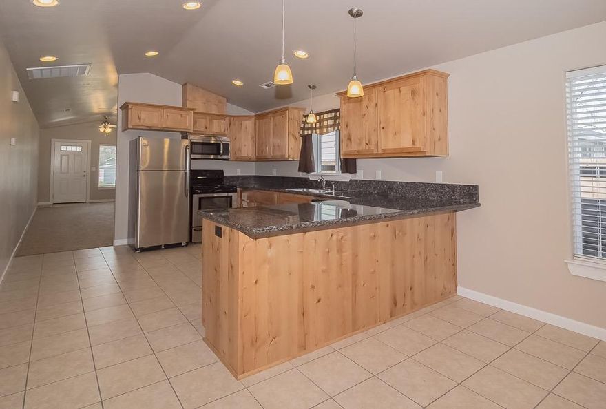 Great Opportunity for First Time Home Buyer / Investor - 2014 Home - Three Bedroom / Two Bath. Vaulted Ceilings, Granite Counter Tops in Kitchen, Custom Cabinets, Tile Flooring in Kitchen - Natural Gas Forced Air Heat / Central Air Conditioning. Near Shopping, Restaurants, etc. The quality shows in every detail. One year First American Home Warranty.