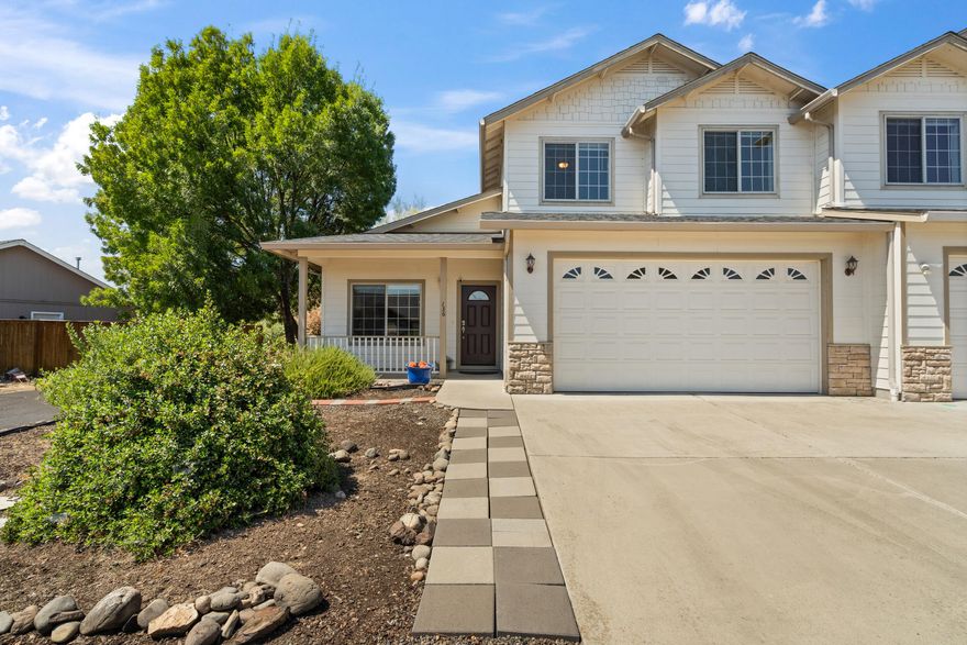 This house comes with a REDUCED RATE as low as 5.875% (APR 6.114%) as of 08/26/2025 through List & Lock™.  This inviting 3-bedroom, 2.5-bathroom townhome offers a well-designed layout with  open-concept living and dining areas that flow seamlessly into a kitchen equipped with modern appliances. The main-floor primary suite features a walk-in closet and a double-sink vanity. Upstairs, two bedrooms share a full bathroom and a versatile landing space. The covered backyard patio provides a serene setting to enjoy the surrounding views. Located near Eagle Point High School, this home combines functionality with a prime location. The downstairs LVP flooring is brand new giving a fresh feel upon entering the space. Explore the opportunity to purchase 130 Dianne Way alongside this unit, offering a unique multifamily living or investment option. NEW ROOF and AC unit in 2022!