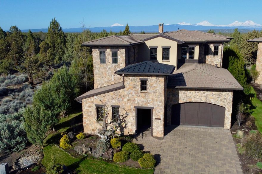 LIVE, PLAY & EARN!! The premier lot offers unparalleled privacy & breathtaking, unobstructed Cascade Mountain views over the 17th Fazio fairway. The timeless natural stone exterior features a welcoming courtyard, a see-through stone fireplace creates a warm, inviting atmosphere.  Multiple French doors open to a courtyard & covered patio with an outdoor kitchen, firepit, fireplace, and a putting green/bocce court—perfect for entertaining. The stunning primary suite boasts a fireplace, sitting area, coffee bar, spa-like bath, private balcony & expansive views. A lock-off 3rd bedroom & bonus area with a kitchenette provide additional guest comfort & privacy.  Home includes an office/4th bedroom, a spacious & climate-controlled wine cellar, an oversized 2-car garage & a separate golf cart garage. Updated lighting, paint & stylish window treatments! List price includes a Premier $115,000 Club Membership. With a strong nightly rental history, this furnished property is a rare opportunity!!!