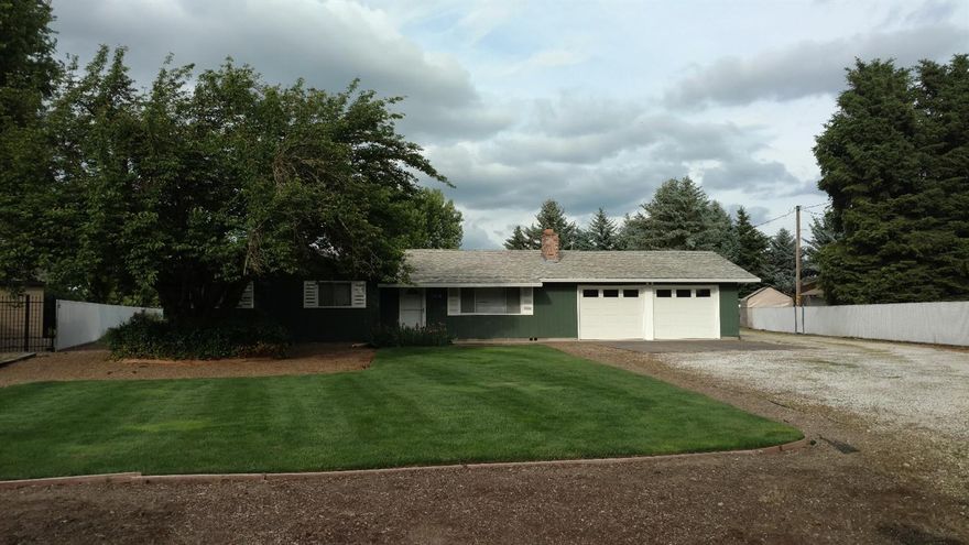 Great home that sits on over 1 acre very close to the City of Central Point yet has country feel. This three bedroom, two bath home needs some TLC but the bones are good, the location is excellent. In-ground sprinklers, manicured lawns and trees. Inside you will find a large living room with a wood fireplace. A small dining room located off the kitchen, indoor laundry facilities. Three large rooms and two bathrooms. There is a lot of potential with this home. Room for RV parking, shop, barn, etc. etc.