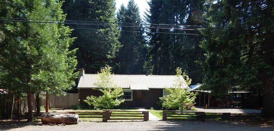 Nestled in the hills of Prospect Oregon is this darling little home on 1.81-acres. Needs some TLC, but can shine again. This 2-bedroom, 1-bathroom, living room, dining area and kitchen also has a garage and attached carport. Out back are some tall timbers and a lawn. One well is shared with neighbor, however there is another well that has not been used, per owner. This home is being sold As-Is, hence the price. Cash only and inspections are for buyers' knowledge only. Buyers to do their own due-diligence.
