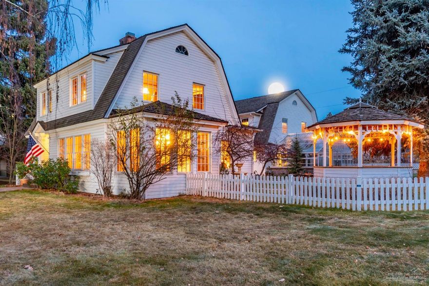 A classic Dutch Colonial Revival design that was originally built in 1921 and totally remodeled & updated in 2001 to include a two story addition w/guest quarters, a greenhouse/solarium and large 701 sq ft garage. A perfect location and picturesque setting on an expansive corner lot across from Drake Park with views of the Deschutes River's Mirror Pond from the custom built gazebo. This warm and accommodating home has been lovingly cared for thru the years and the flexible 3651 sq ft 4 bdr, 3 bath floor plan offers room & space for everyone. The inviting chef's kitchen opens to a grand library/dining room w/french doors.