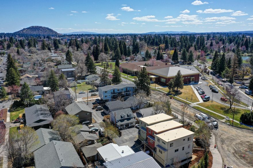Don't miss this rare opportunity to own 3 townhomes in NW Bend and close to downtown. Perfectly located for quick access to Drake Park, the Deschutes River, many trails, trendy restaurants, breweries, and coffee shops! Each 2015 built townhouse has 4 bedrooms, with both a master and junior suite; 3 full bathrooms, laundry room, large pantry, plenty of storage space, and an alley accessed  2 car garage. Inviting open living concept on the second floor.  You'll love the quality finishes with quartz countertops and tile backsplashes in both the kitchen and bathrooms, soft close cabinetry, gas range, and a natural gas force air heating system with central AC.  A second story deck overlooks Newport Avenue and the mature landscaping watered by a drip irrigation system with timer to keep the many trees and shrubs looking good. Close in on the westside of Bend and also a great launching point for the many activities Central Oregon is cherished!