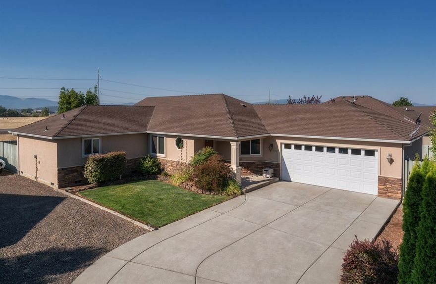 This 2006 built home is in like-new condition and clean as a whistle. It's nestled at the end of a small cut-de-sac where you'll enjoy RV parking, a large drive way and an attached two-car garage. Inside you'll find a well-appointed kitchen with granite counters and plenty of cabinets. The master suite is complete with private bath, walk-in closet and is set apart from the other two bedrooms. Vaulted living room ceilings and an open-concept layout provide plenty of light throughout. The slider off the living room leads to a private fenced back yard perfect for kiddos, pets, or BBQs and there are no neighbors directly behind. The home is situated in a neighborhood of newer, well-kept properties and is awaiting its new owner. Call now to schedule a private showing today!