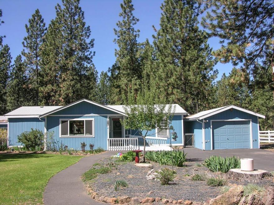 Great Home on an Acre with 2-Garages + Studio! SW Bend 3Bd/2Ba charmer features: great room, open country kitchen/dining, spacious master suite w/his & her closets & private bath w/shower stall, the big back deck is partially covered, patio area, newer roof, FA heating & wall AC unit, extra deep single car garage w/bench + separate extra deep double car garage w/bench + small hobby room/shop heated & insulated, green house, raised garden beds, all on a huge corner lot with circular drive & room for RV too!