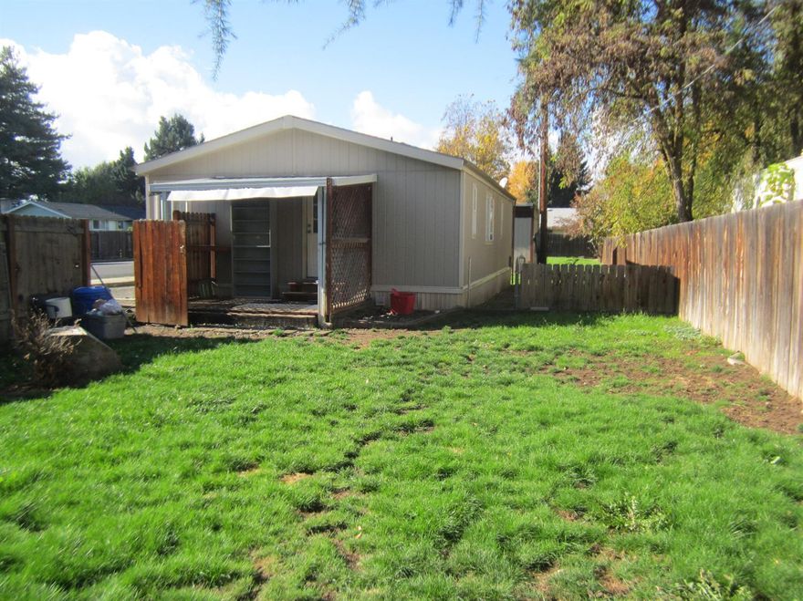 Nicely maintained 960 sq ft 2 bedroom, 2 bathroom manufactured home on larger lot! Fully fenced yard. Big kitchen, great closet space. Master Bedroom has master bath with garden soaking tub. Living room has nice fireplace stove. Lots of windows for natural light.