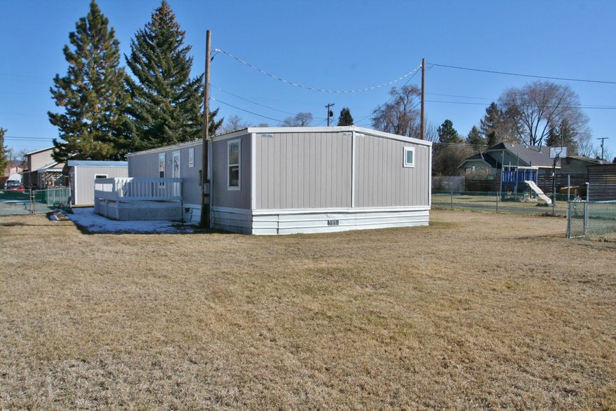 Clean and tidy in move-in ready condition with loads of attractive new paint, vinyl & carpet too. Updated interior doors, newer exterior siding, vinyl windows, F/A gas heat, new gas water heater being installed & more. Super shop area that could serve a multitude of needs or hobbies. Fully fenced yard with fenced garden area/dog kennel, RV gate to allow access for additional parking too. Easy to show and ready for new owner!