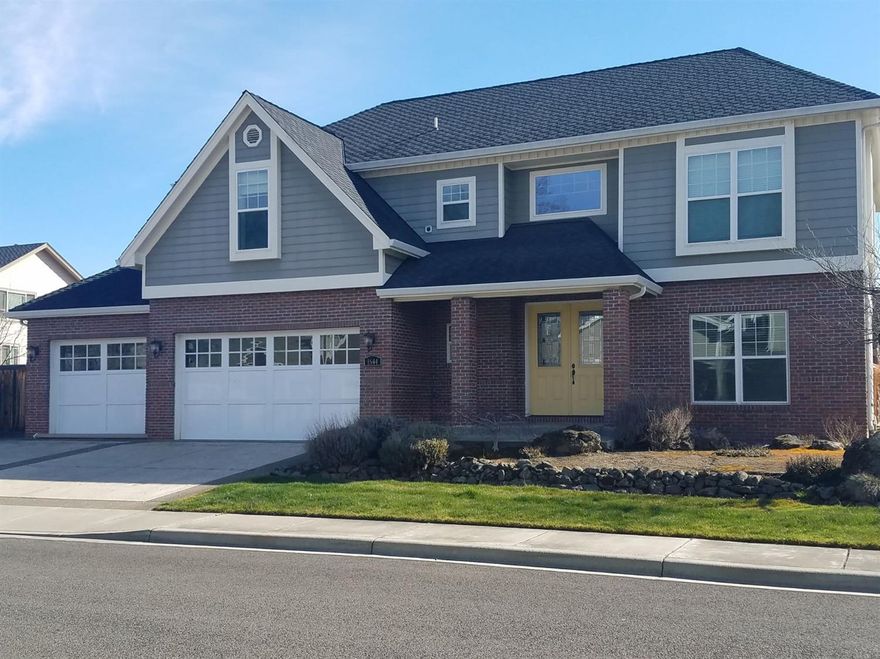 This beautiful 4 bedroom home was built with attention to detail. It has the expected bells and whistles including Granite counters, Double wall oven, stainless cook top with power burner, instant hot water, handmade hammered copper sink, 2 drawer dishwasher, Hardwood and tile flooring, 9' ceilings upstairs and down, Gas fireplace, central vacuum as well as marble window sills and double hung windows for easy cleaning. Master bedroom and office/family room have new carpet. Outside enjoy fully landscaped yard with natural rock feature and in ground sprinklers, faux slate driveway with exposed aggregate accents and brick on the front of the home. RV parking next to 3 car garage.