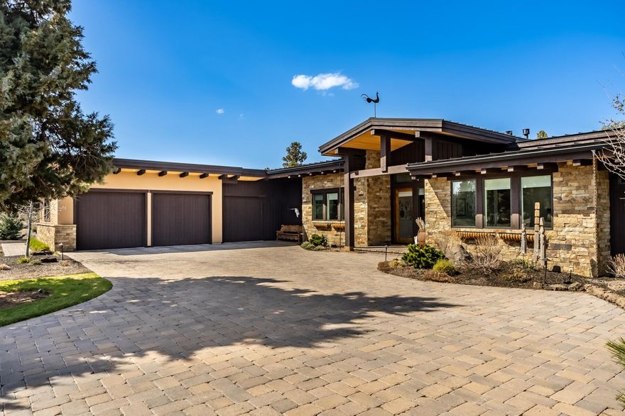 Chic, clean and contemporary 2,724 sq.ft., single level home on .82 acres in The Estates at Juniper Preserve and Pronghorn Club in Bend, Oregon. This home is light & airy with 14 foot ceilings & a thoughtful floorplan that incorporates 4 large bedrooms & 4 full bathrooms. Spacious Kitchen w/Thermador
range & refrigerator, quartz countertops, large island w/2nd sink & barstool space, plus the perfect blend of custom cabinetry & open shelving creating a sophisticated, modern space. Living spaces flow gracefully from inside to out w/glass doors and windows that allow for an abundance of natural light. Enjoy a Great Room and Dining Room, both w/access to the Outdoor Kitchen & Dining spaces, 2 firepits w/separate lounging areas & a private hot tub.
The light & bright interior of this home is elegantly balanced w/reclaimed wood, steel & matte black accents. 3 car garage with epoxy flooring, mud room, full home humidifier, hot water recirculating pump, integrated indoor/outdoor stereo system.